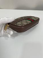 Sac ceinture Gucci en toile GG - Photo 8